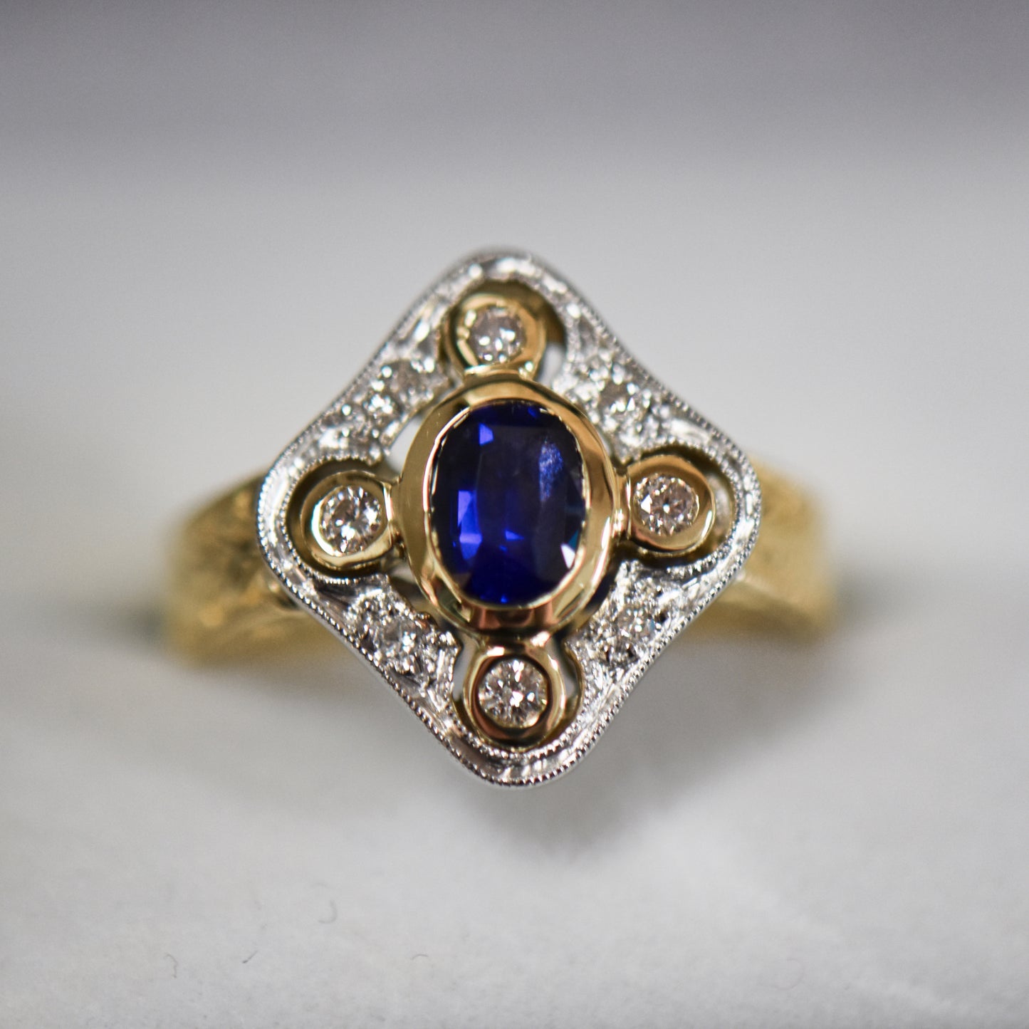 Custom Carved Gold Ring with Royal Blue Sapphire