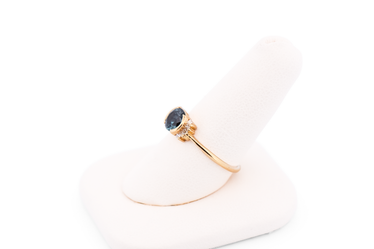 Bezel-Set Teal Montana Sapphire Engagement Ring with Baguette Diamonds
