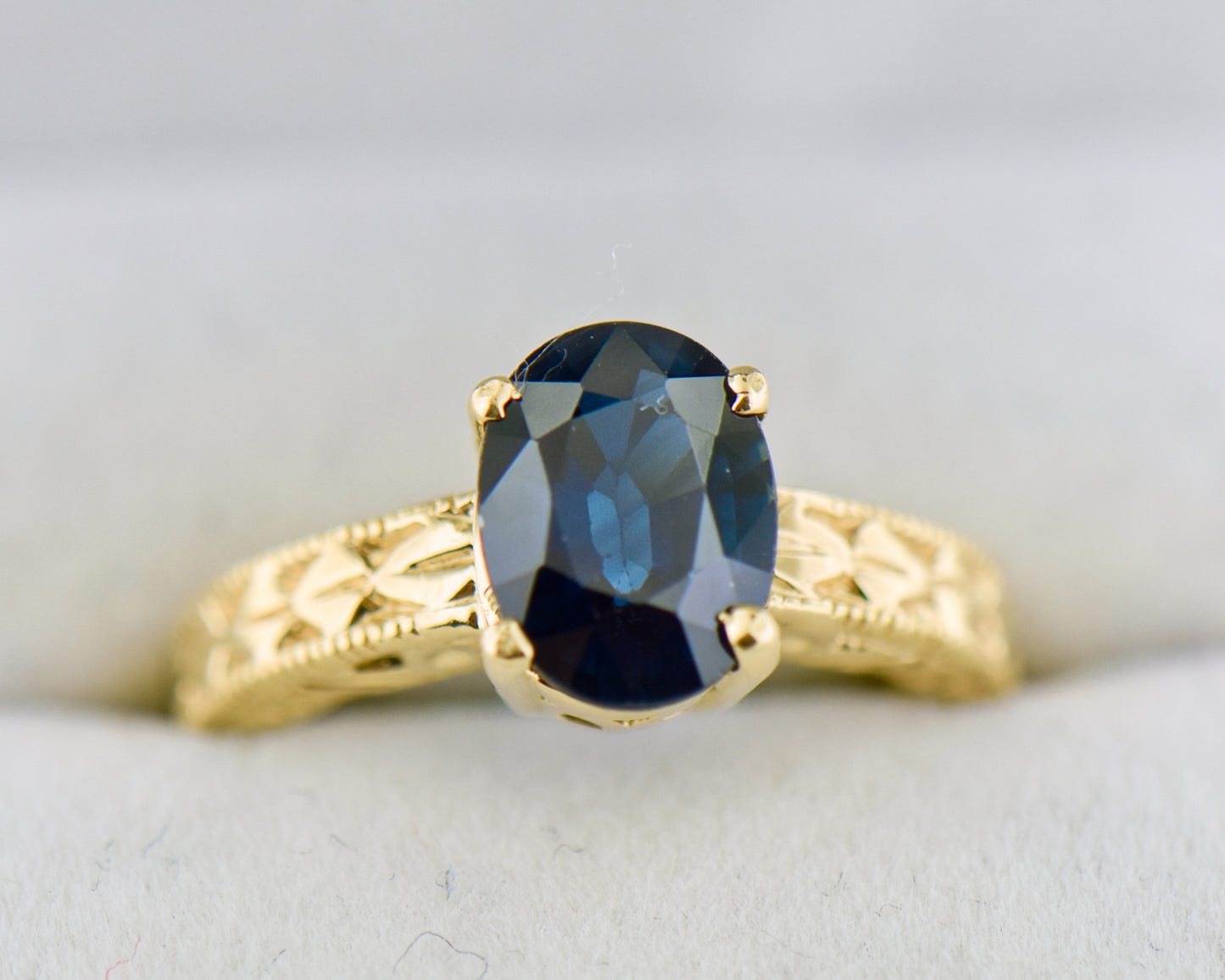 Navy Blue Sapphire Carved Yellow Gold Solitaire Ring