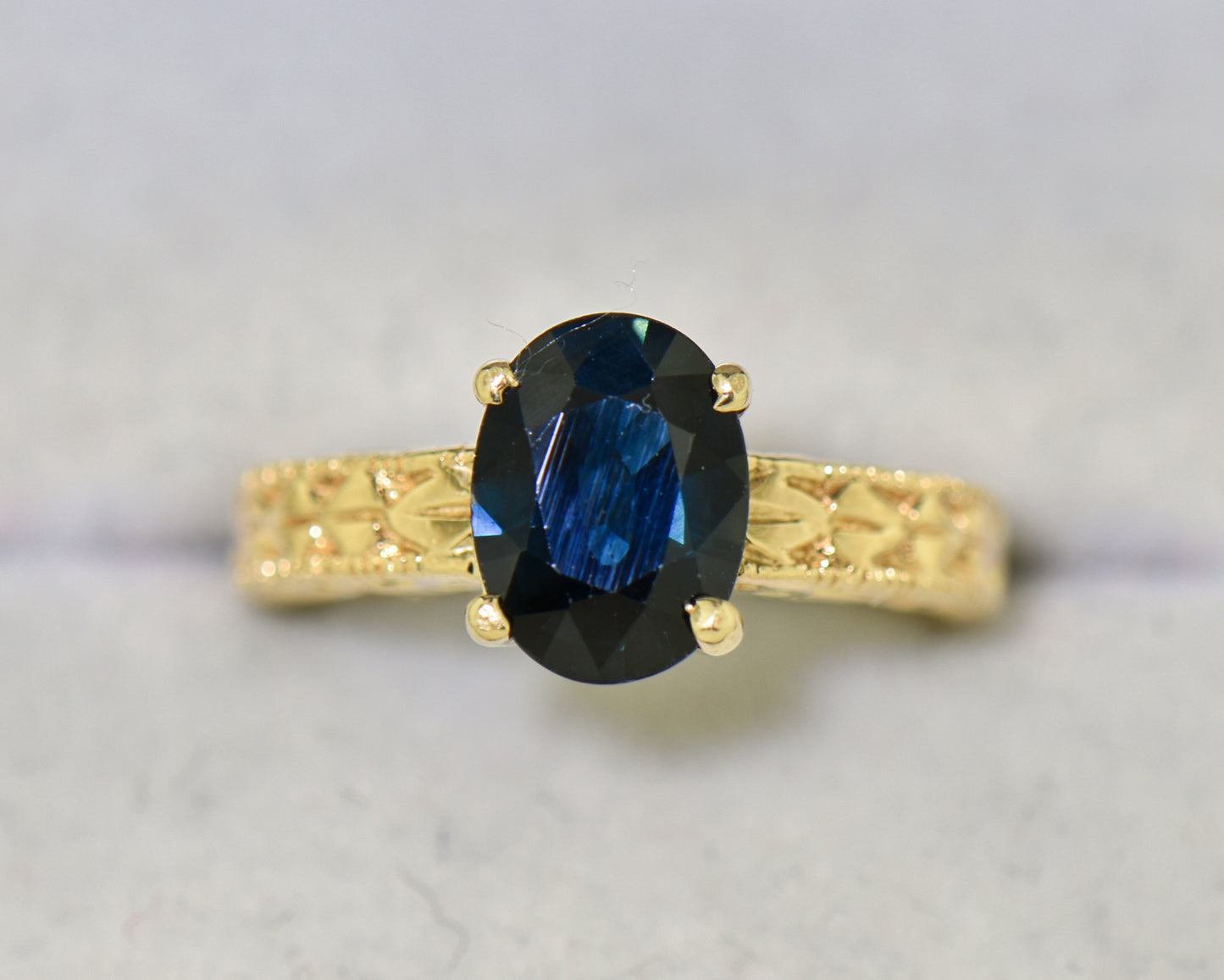 Navy Blue Sapphire Carved Yellow Gold Solitaire Ring