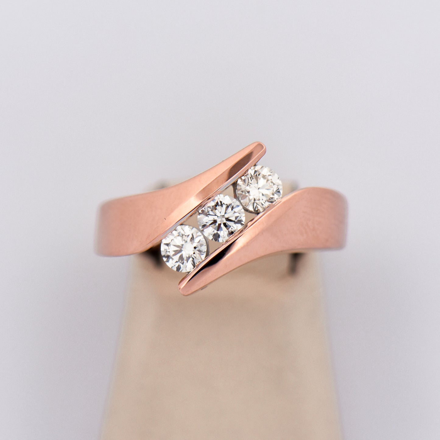 Three-Stone Diamond Channel Ring in Rose Gold