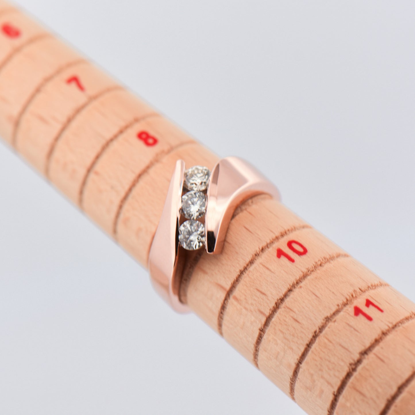 Three-Stone Diamond Channel Ring in Rose Gold