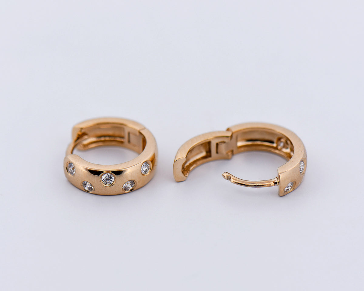 Etoile Diamond Huggie Hoops in Yellow Gold