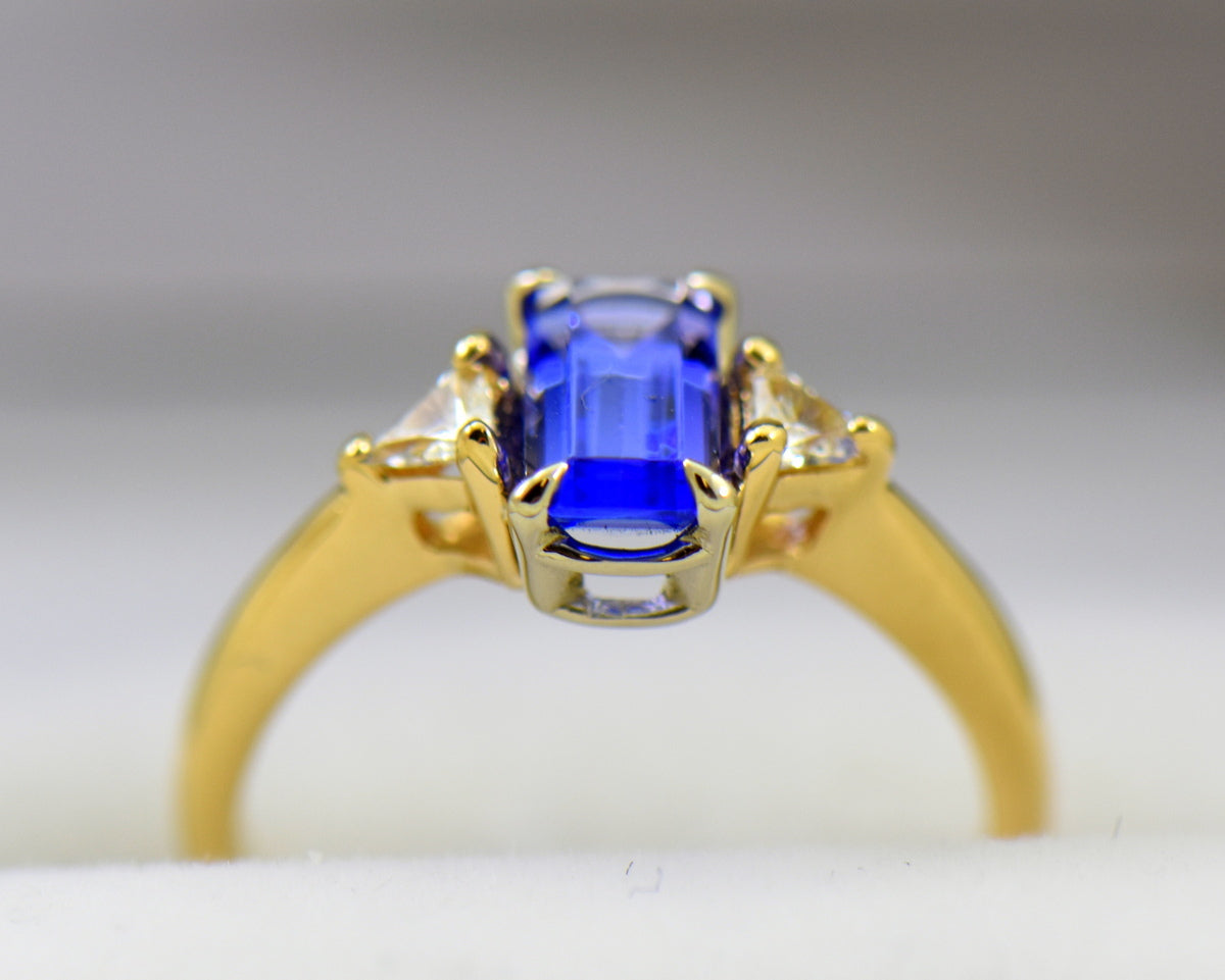 Dainty Emerald Cut Tanzanite & Trillion Diamond 3-Stone Ring