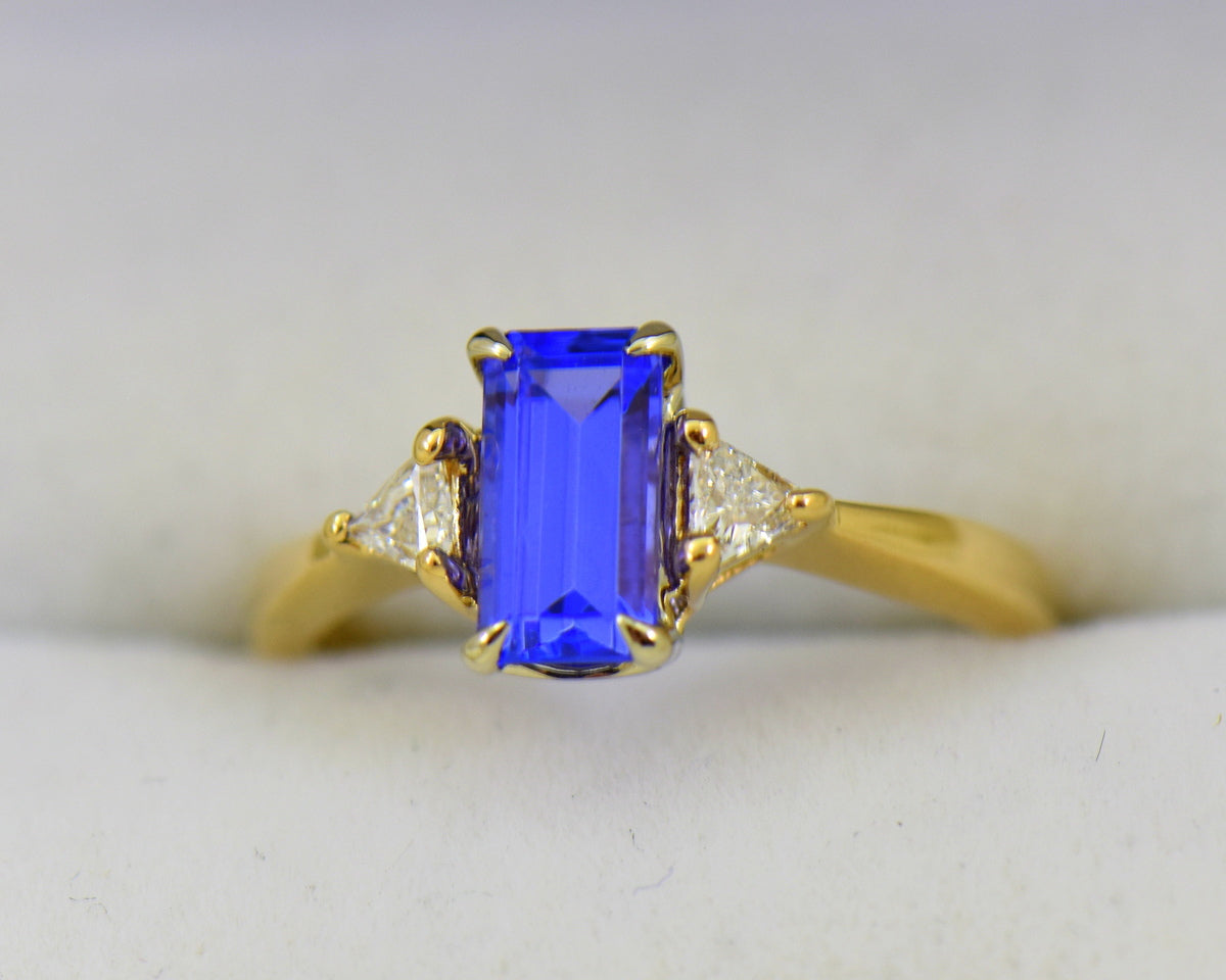 Dainty Emerald Cut Tanzanite & Trillion Diamond 3-Stone Ring