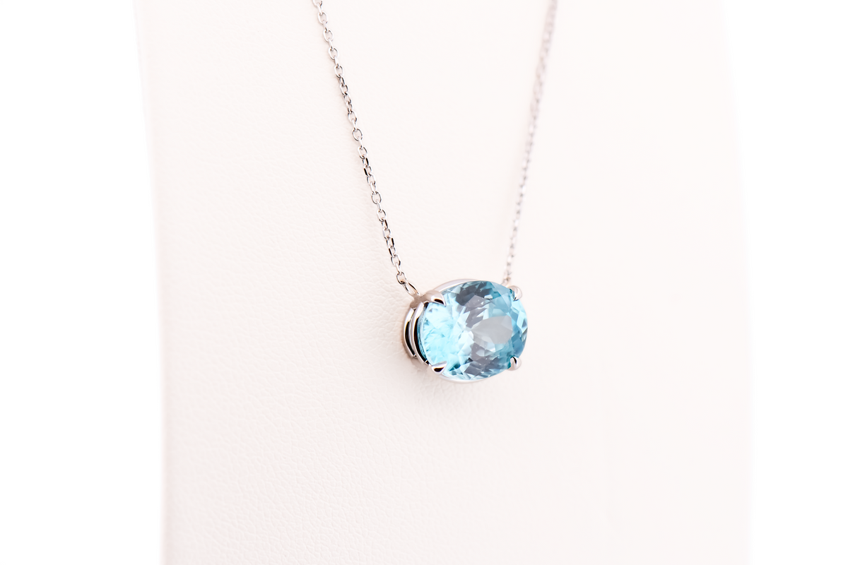 East-West Blue Zircon Solitaire Pendant in 14k White Gold