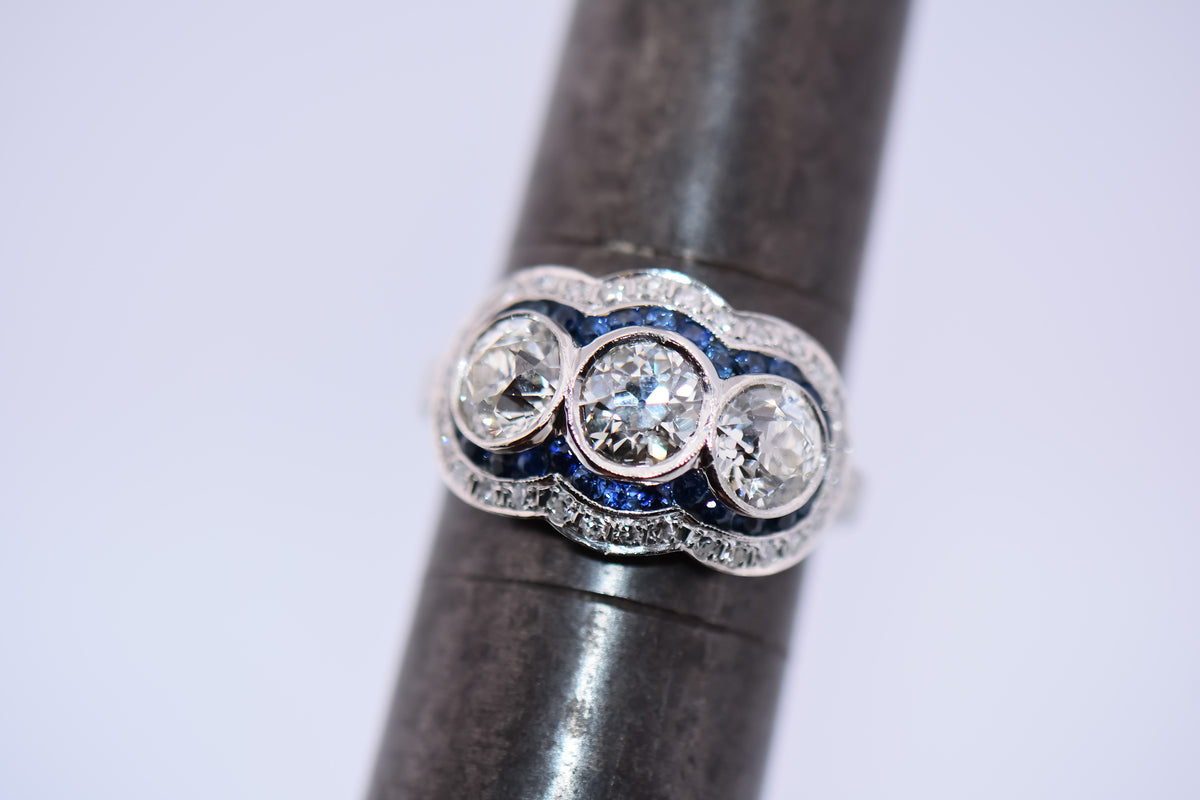 Exceptional Art Deco Platinum Diamond 3-Stone Ring with Sapphire Accents