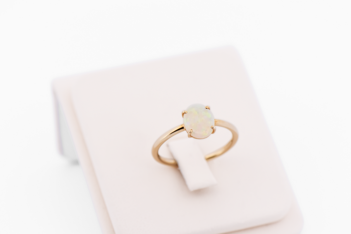 Glittery Opal Solitaire Engagement Ring in Yellow Gold