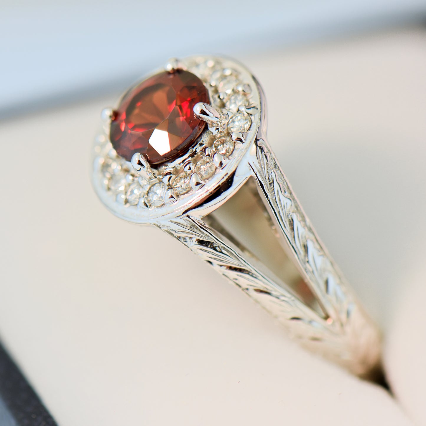 Carved White Gold Ring with Round Red Hessonite Garnet