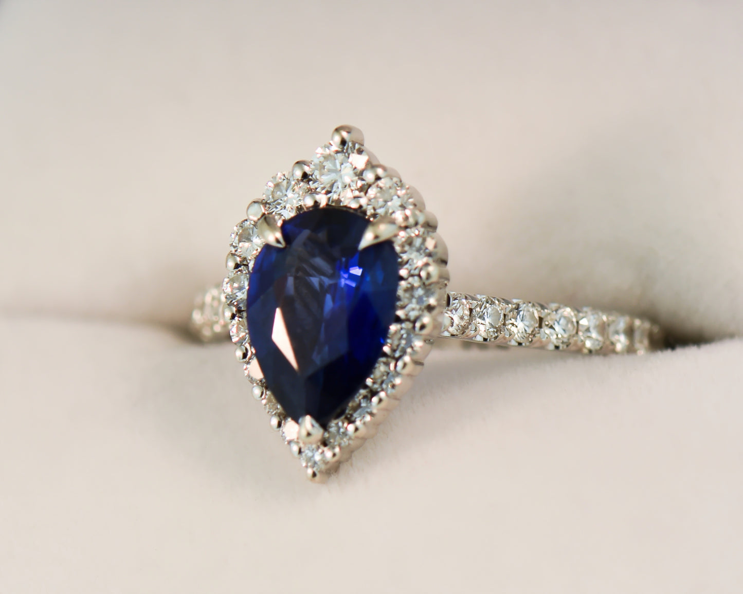 Modern Pear Shape Blue Sapphire & Diamond Halo Ring