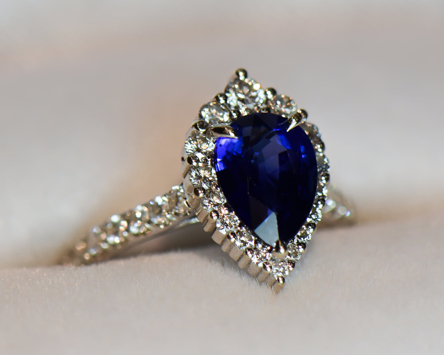 Modern Pear Shape Blue Sapphire & Diamond Halo Ring