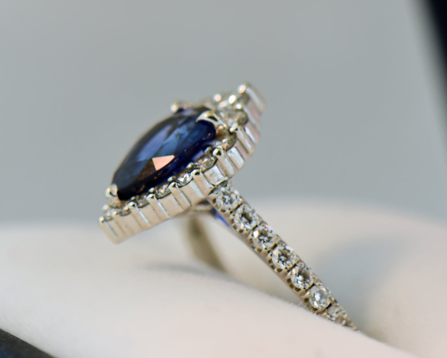 Modern Pear Shape Blue Sapphire & Diamond Halo Ring