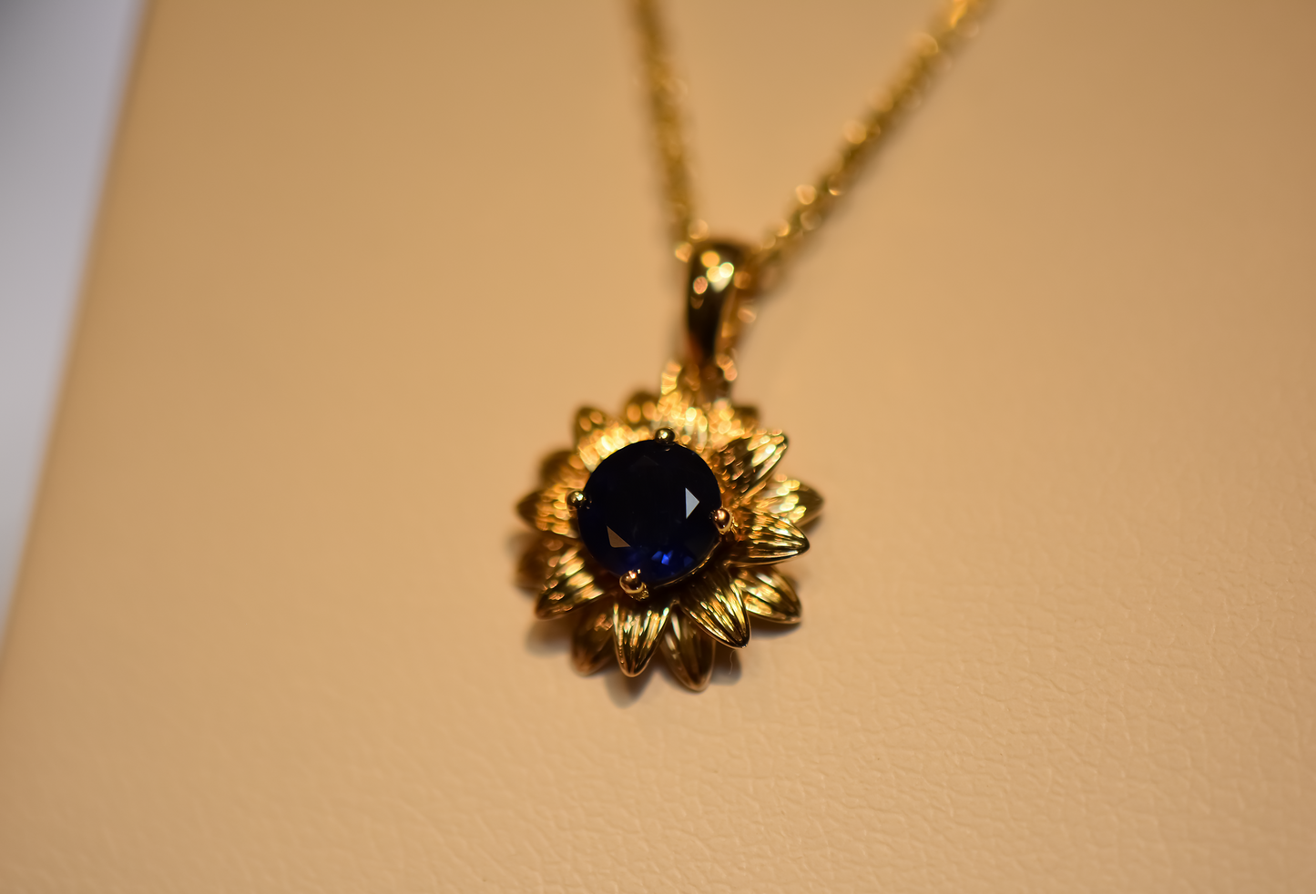 Navy Blue Sapphire Flower Pendant in Yellow Gold