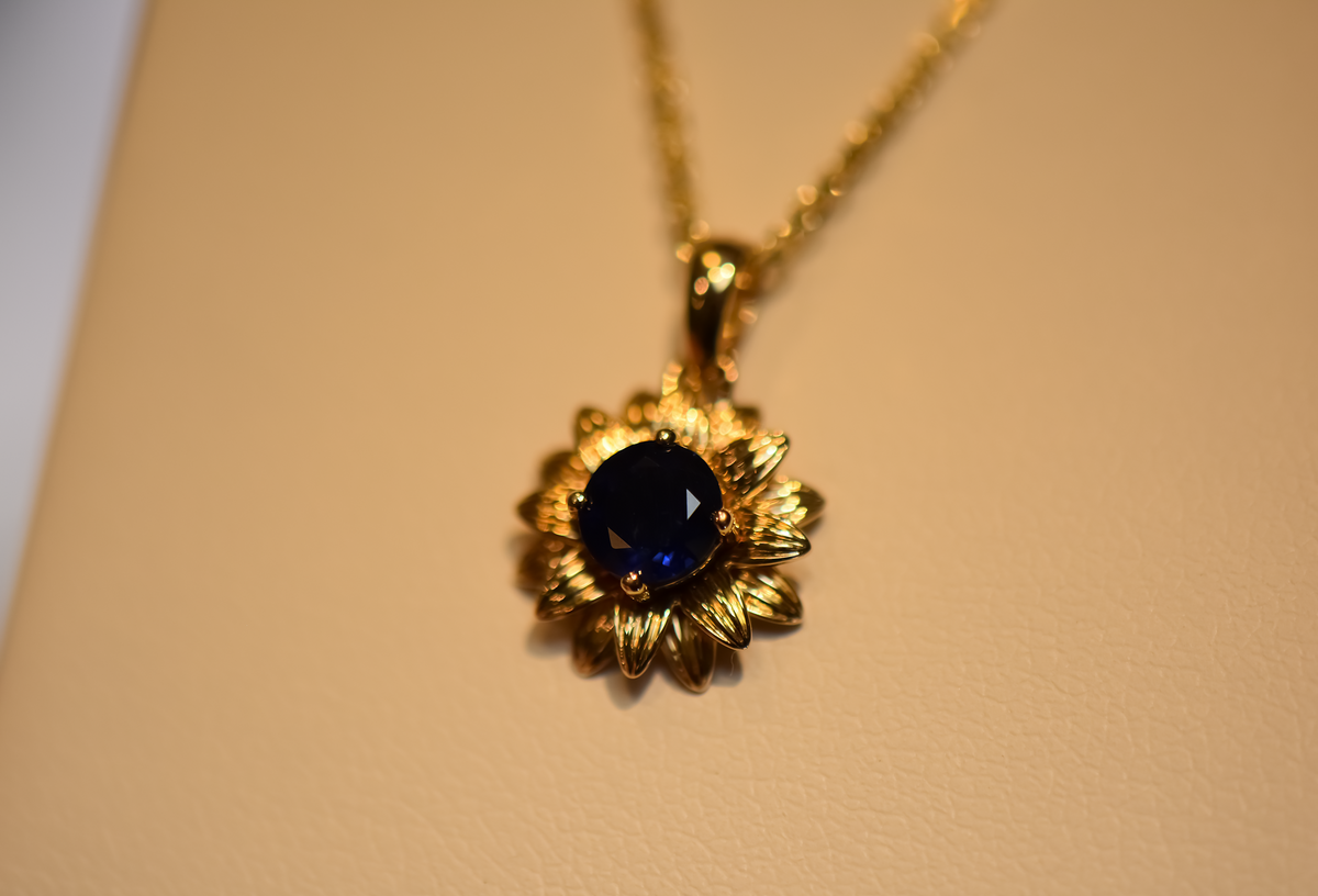 Navy Blue Sapphire Flower Pendant in Yellow Gold