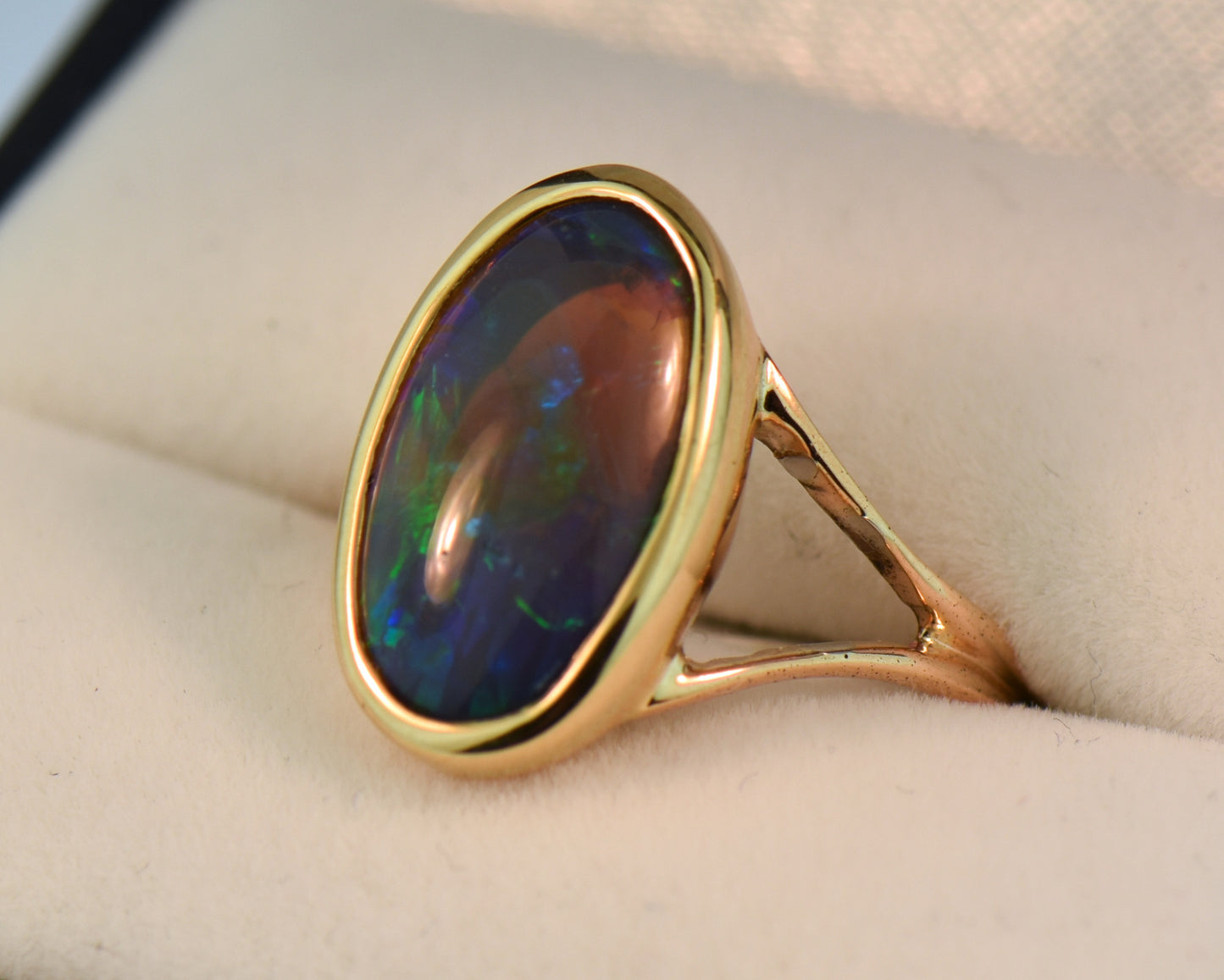 Black Crystal Opal Solitaire Ring in Yellow Gold Bezel
