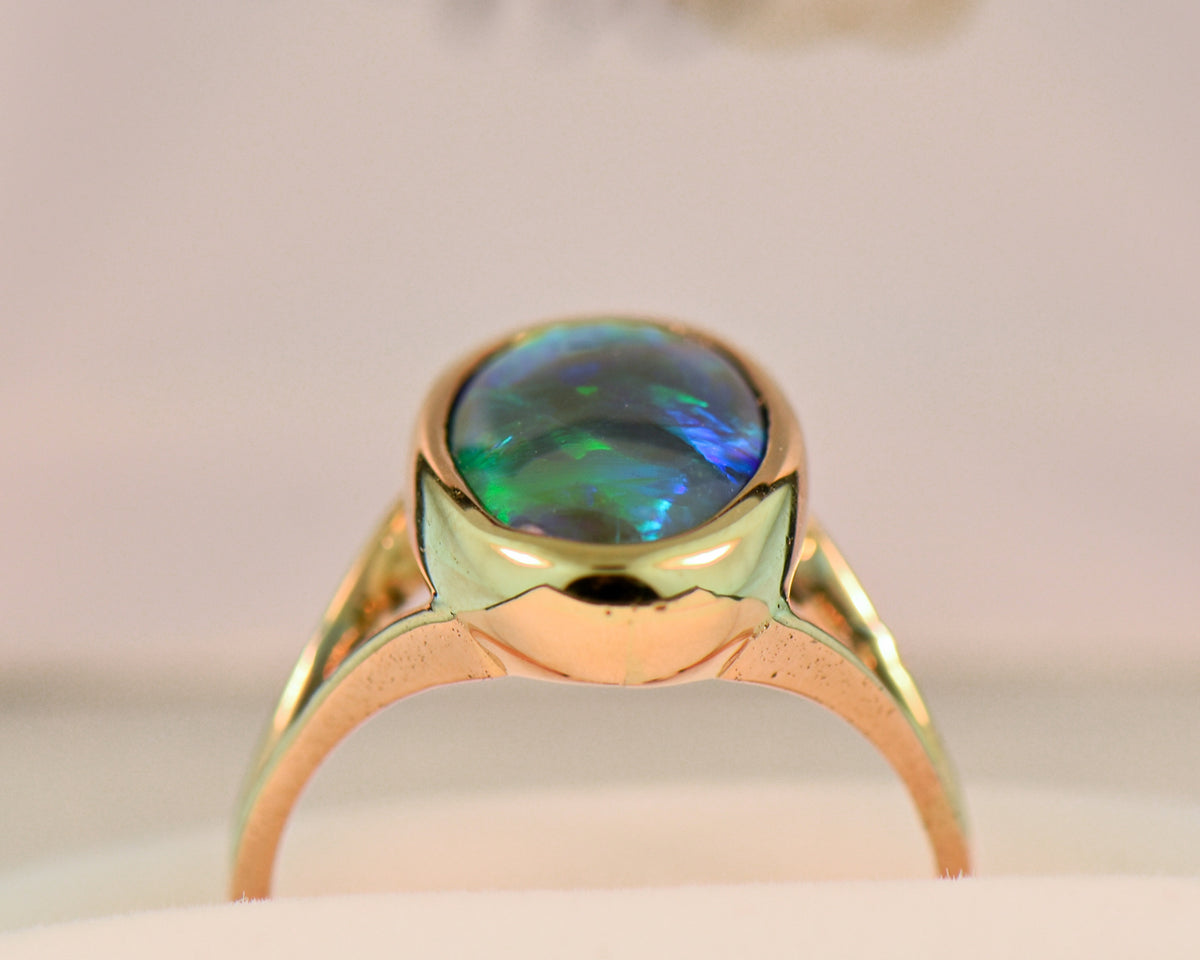 Black Crystal Opal Solitaire Ring in Yellow Gold Bezel