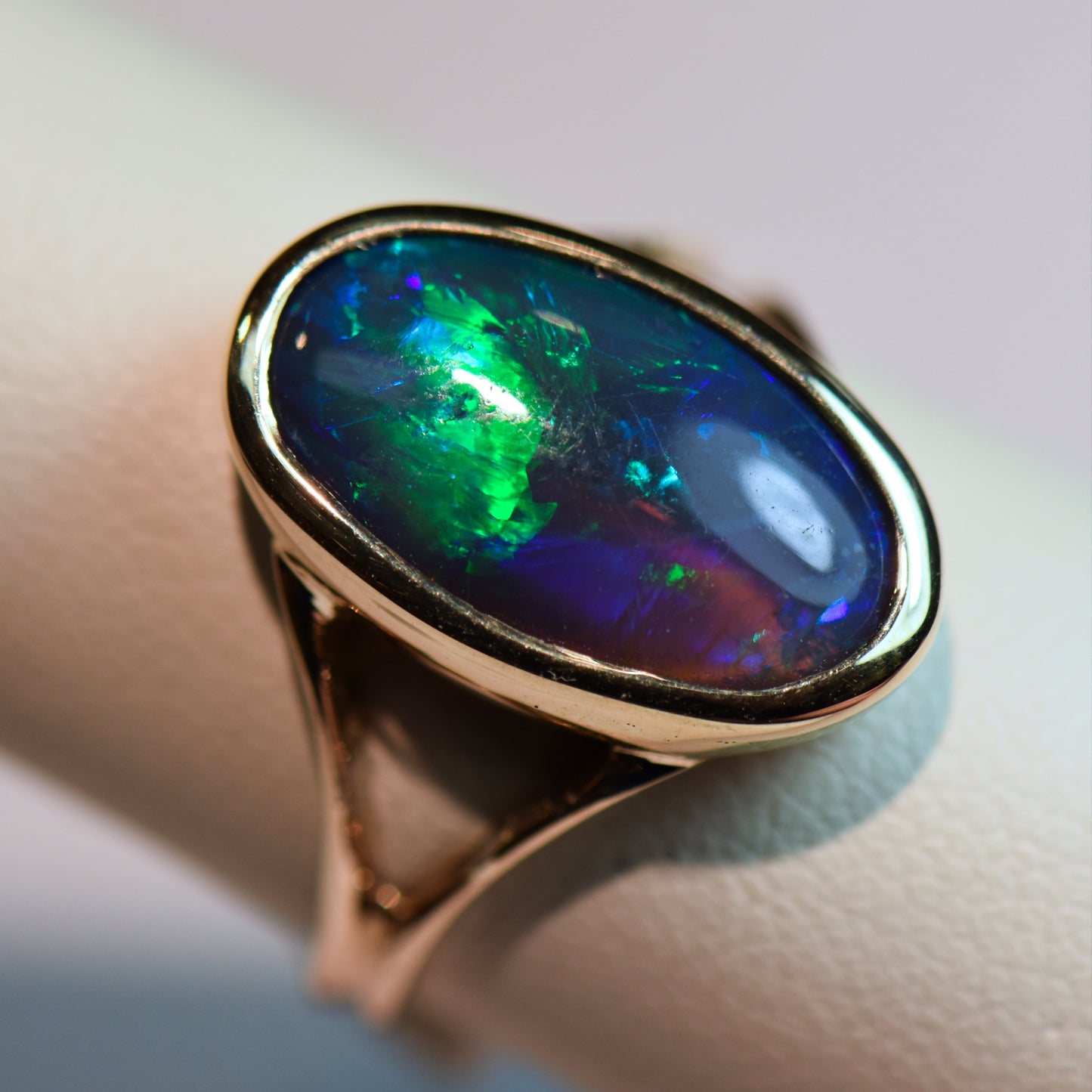 Black Crystal Opal Solitaire Ring in Yellow Gold Bezel