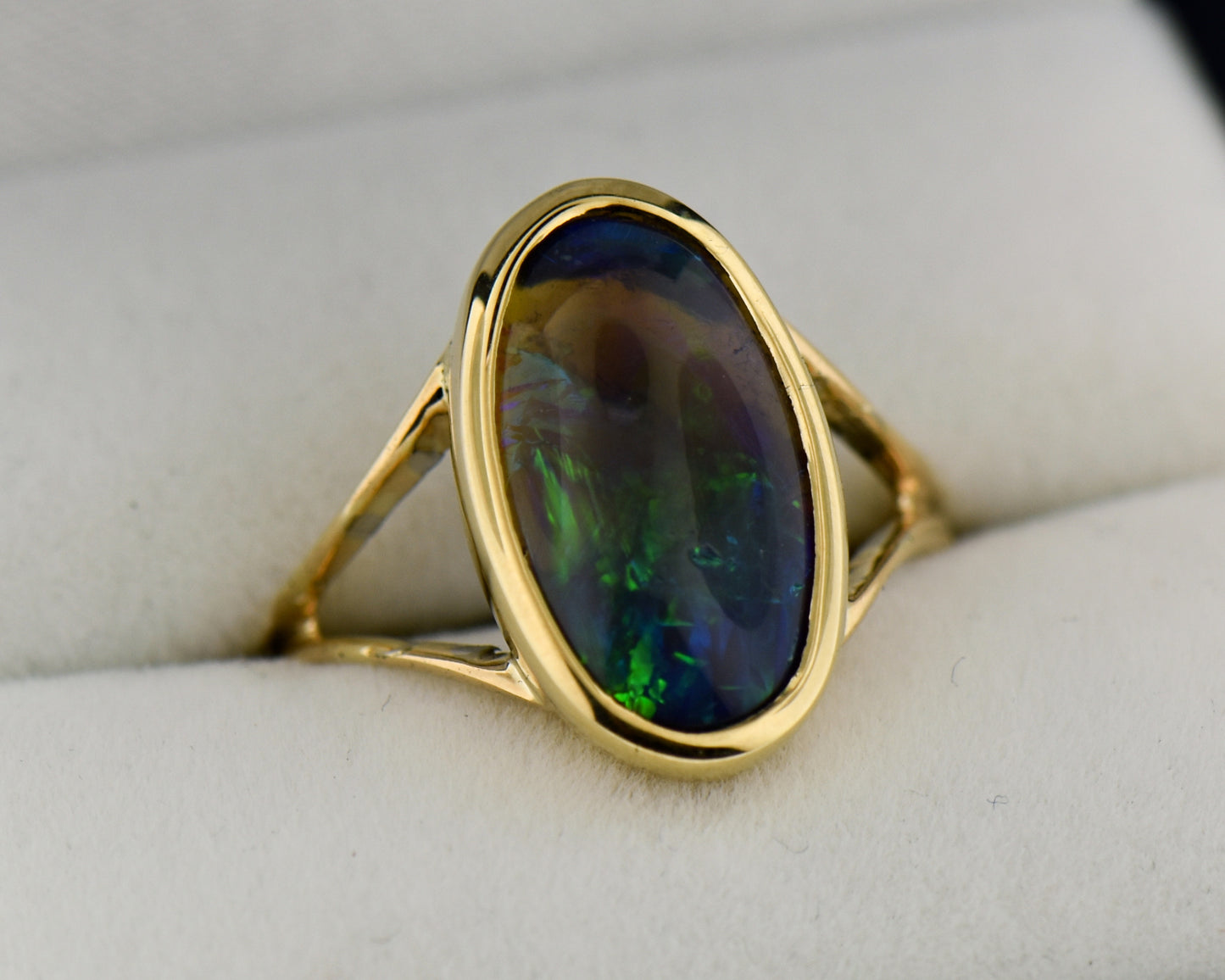 Black Crystal Opal Solitaire Ring in Yellow Gold Bezel
