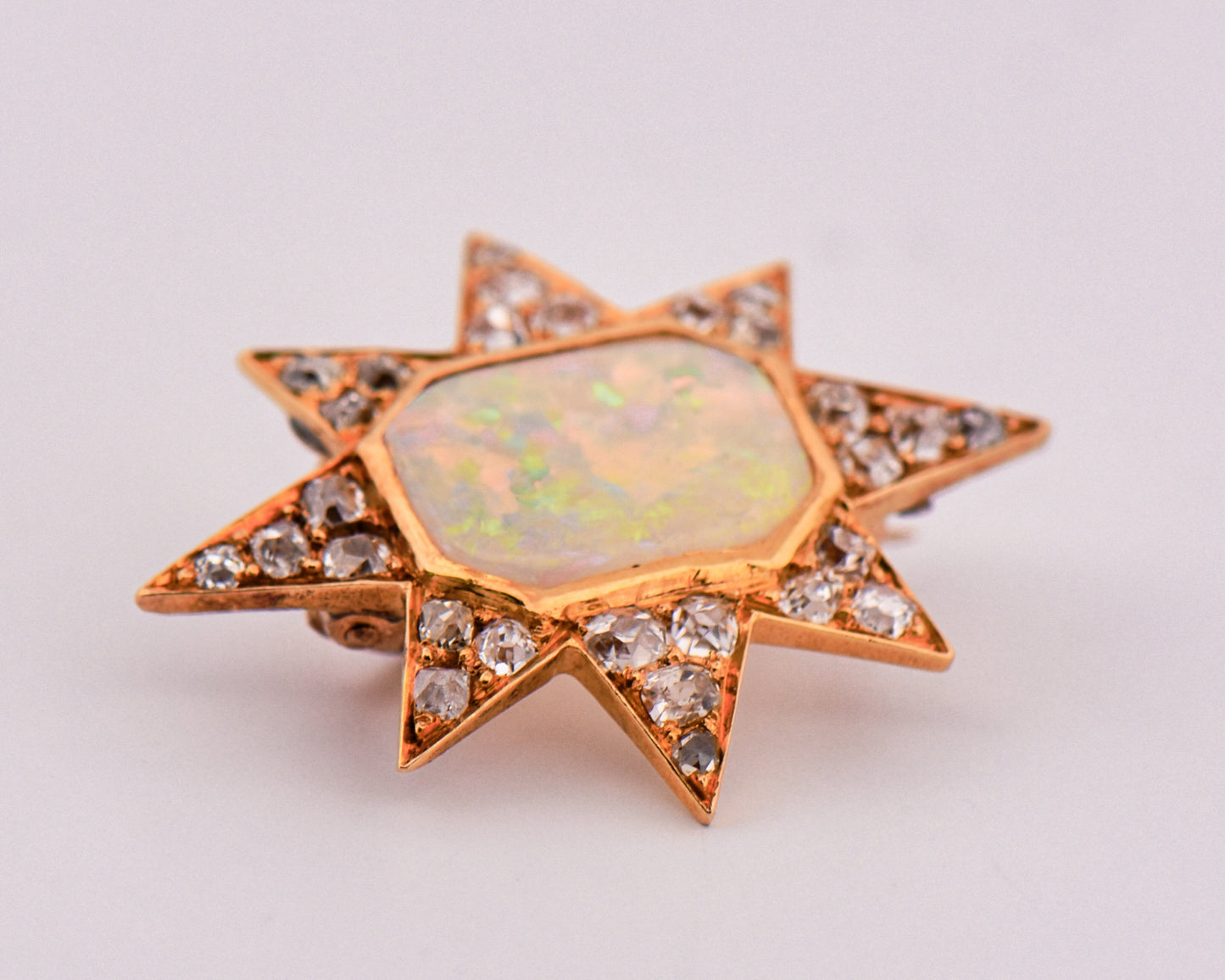 Victorian Gold Star Brooch with Opal and Diamonds