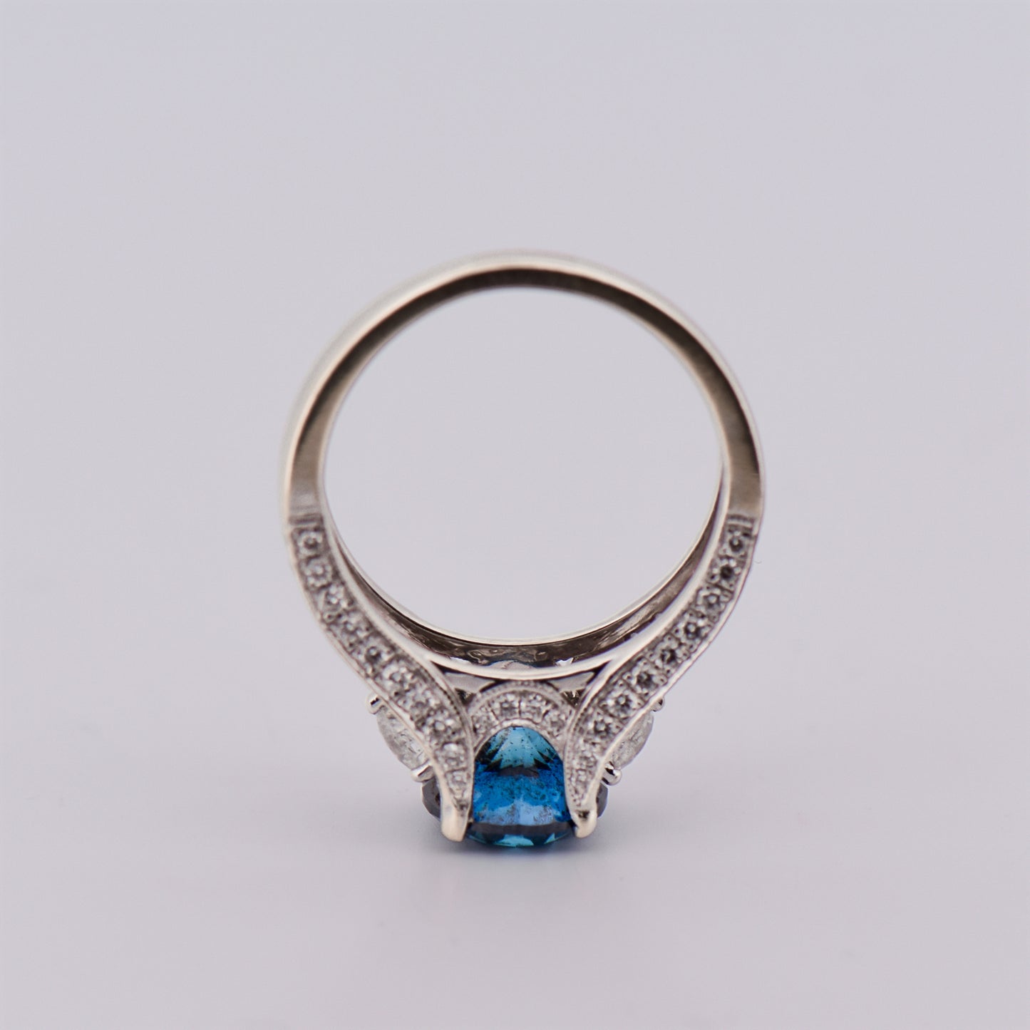 Round Blue Diamond Three-Stone Ring in White Gold