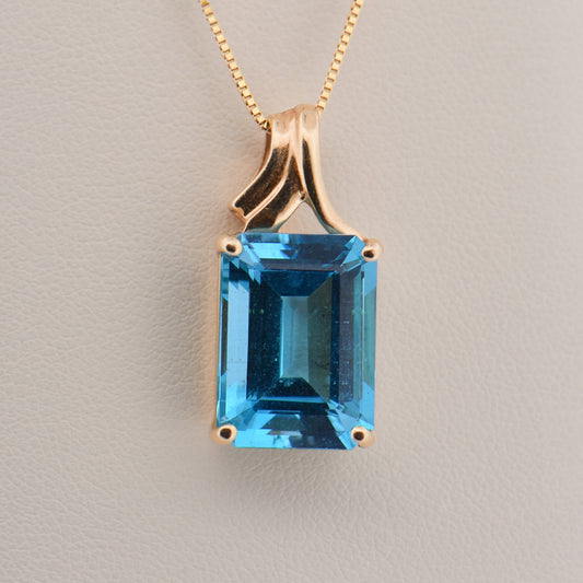 Emerald-Cut Swiss Blue Topaz Pendant in Yellow Gold