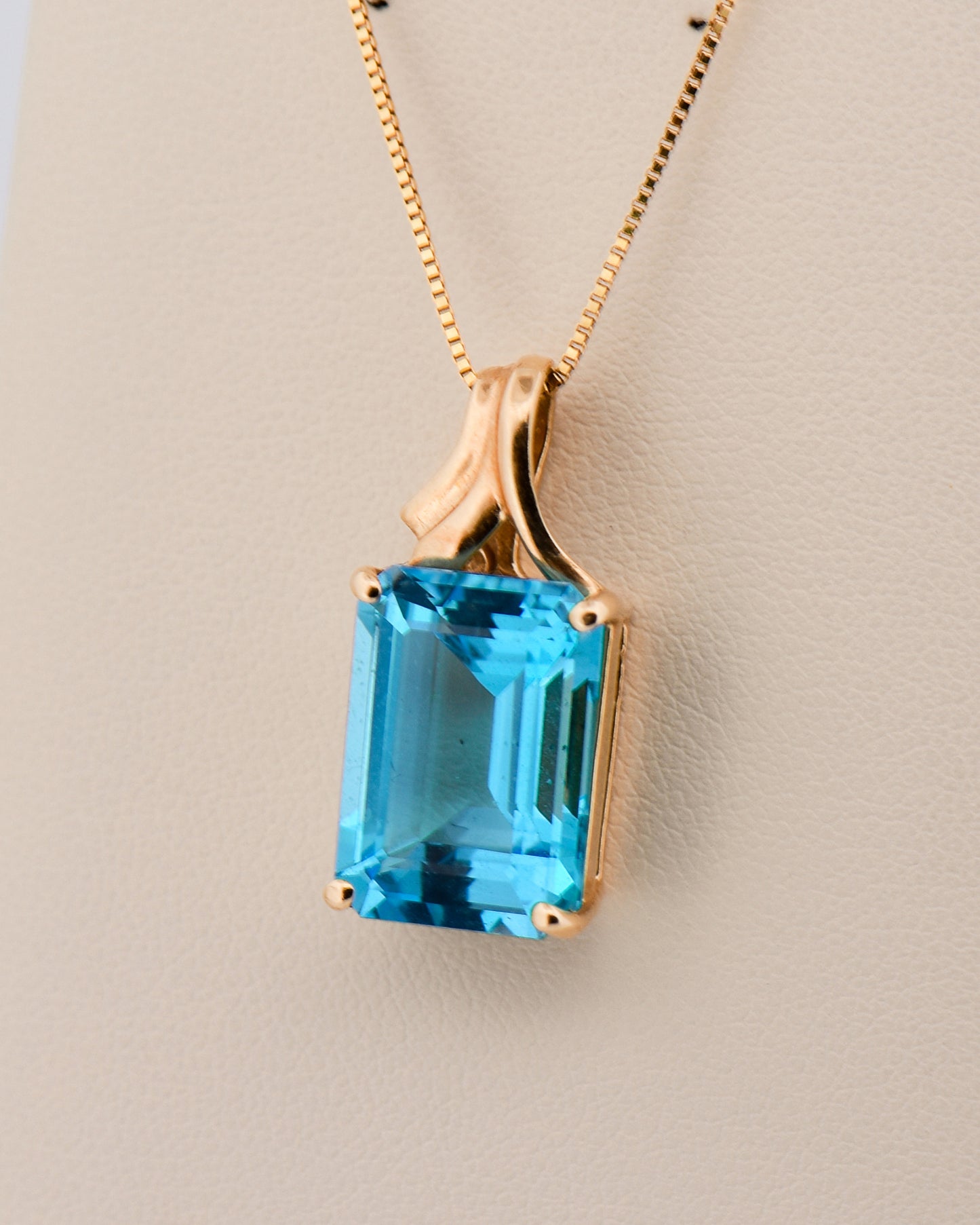 Emerald-Cut Swiss Blue Topaz Pendant in Yellow Gold