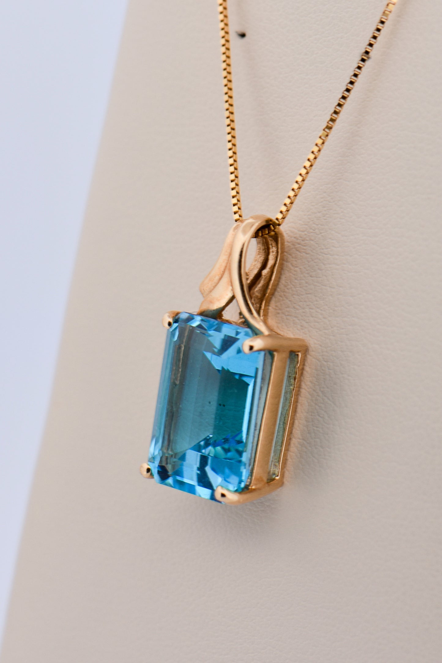Emerald-Cut Swiss Blue Topaz Pendant in Yellow Gold