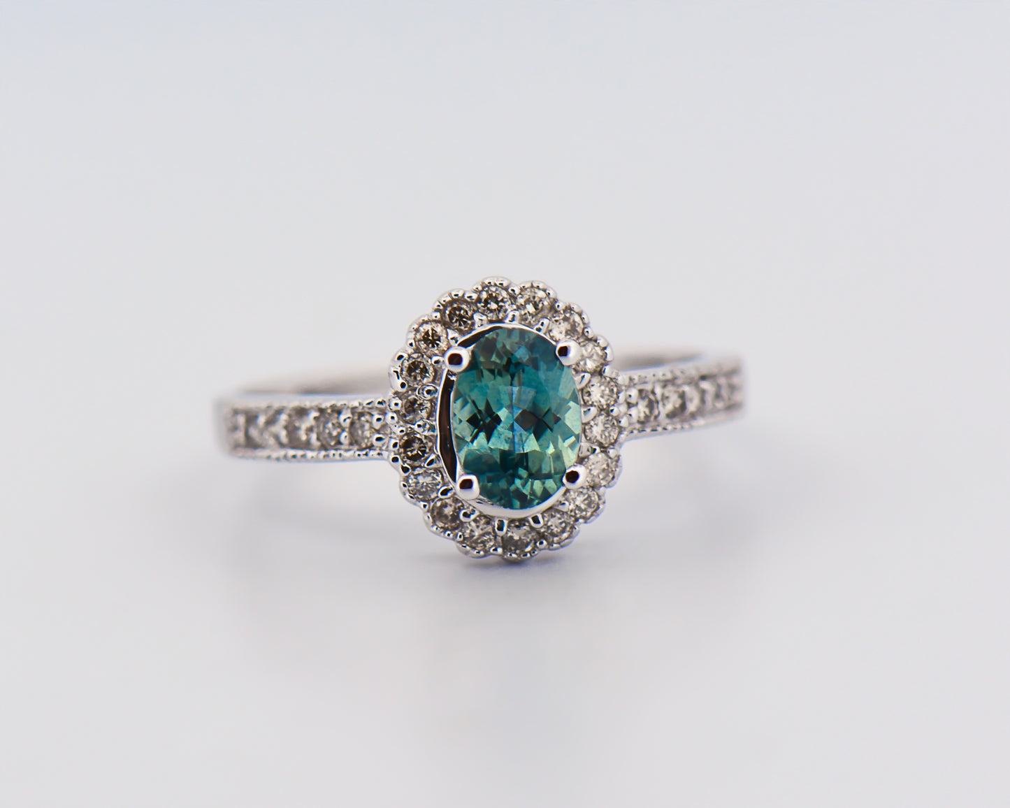Teal Sapphire Halo Engagment Ring in White Gold