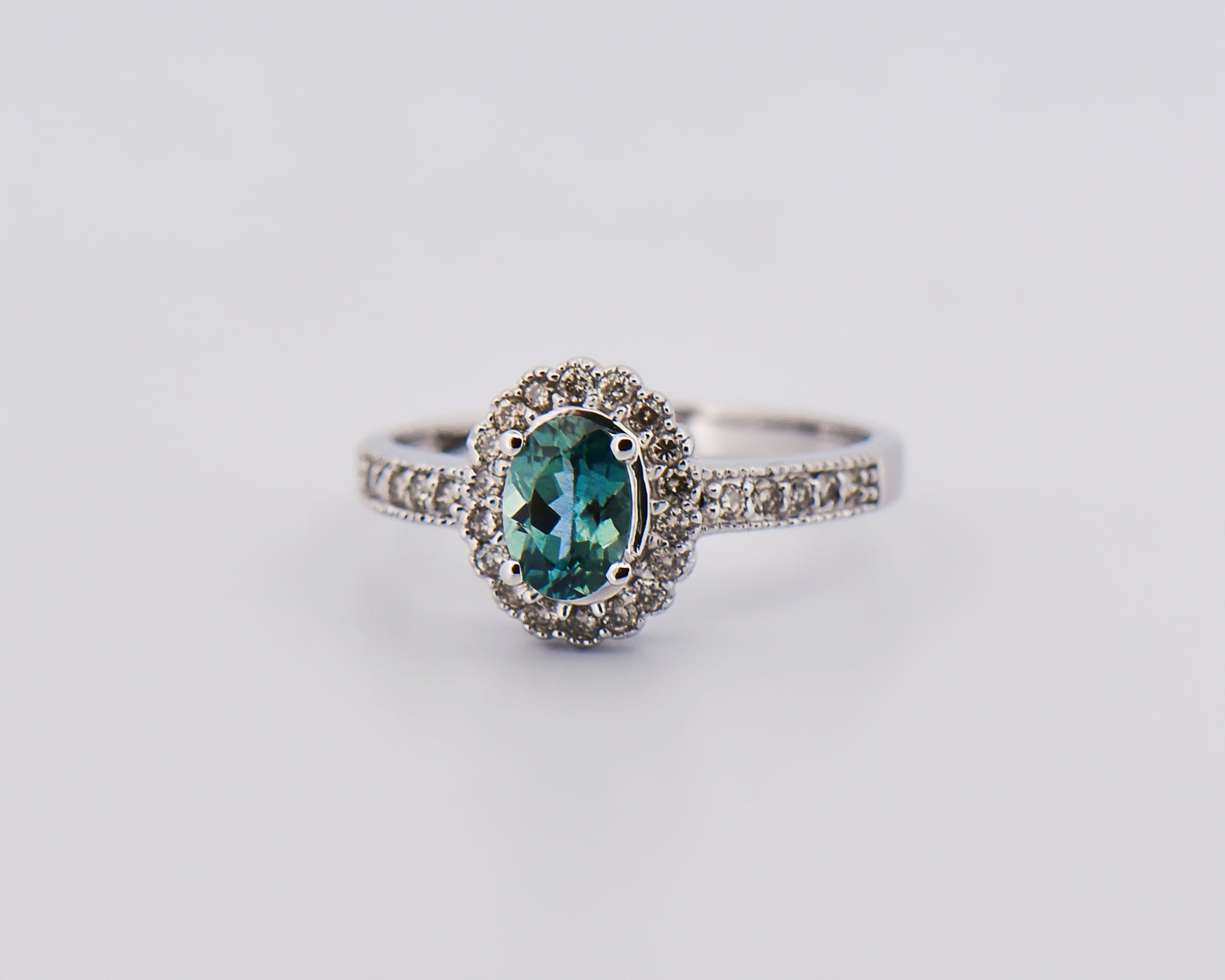 Teal Sapphire Halo Engagment Ring in White Gold
