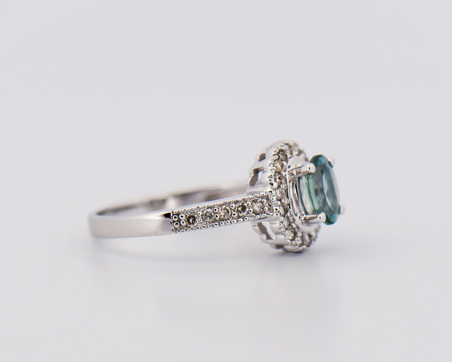 Teal Sapphire Halo Engagment Ring in White Gold