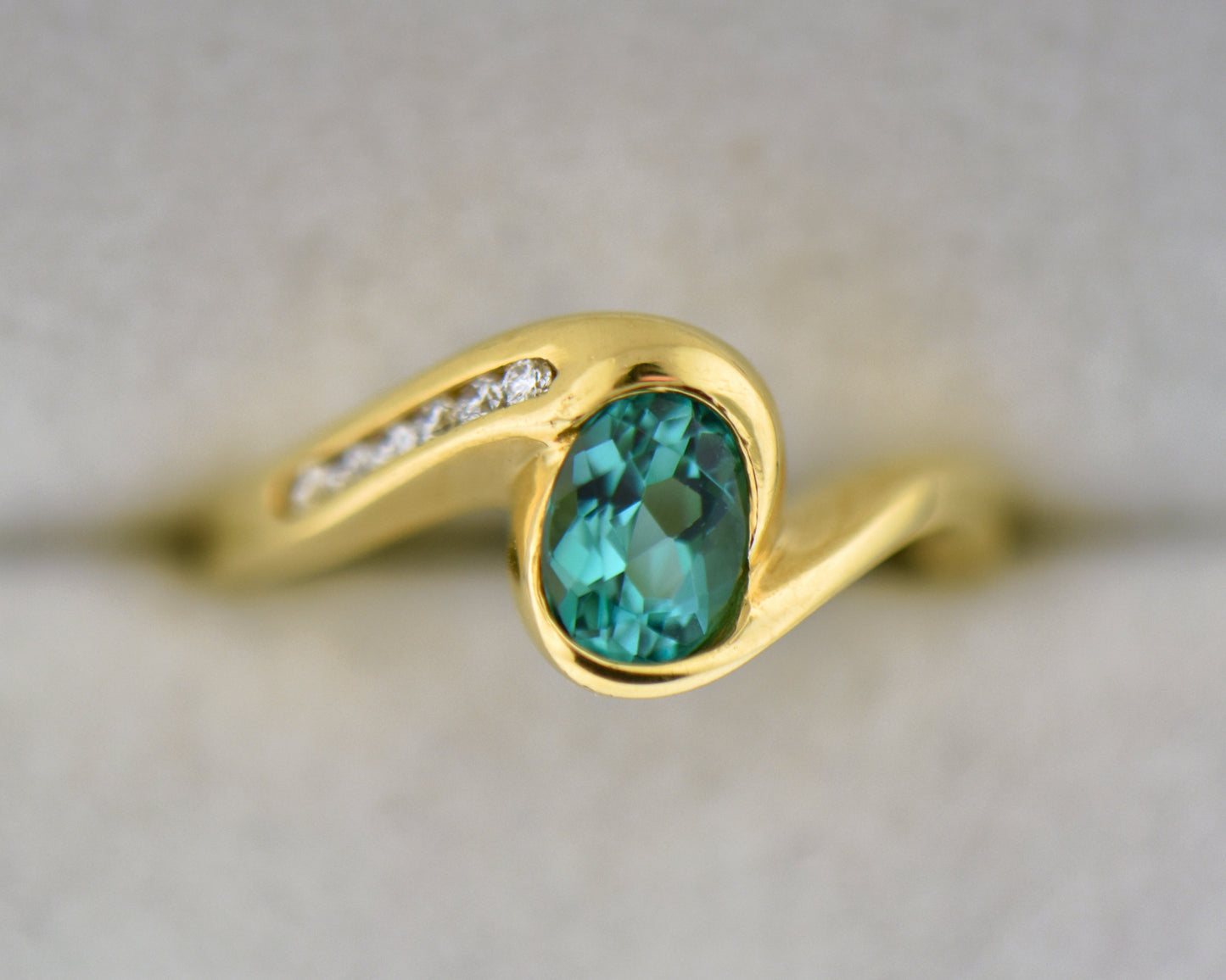 Custom 18k Gold Ring with Bezel Set Electric Teal Tourmaline