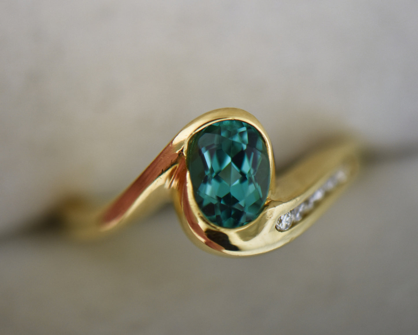 Custom 18k Gold Ring with Bezel Set Electric Teal Tourmaline