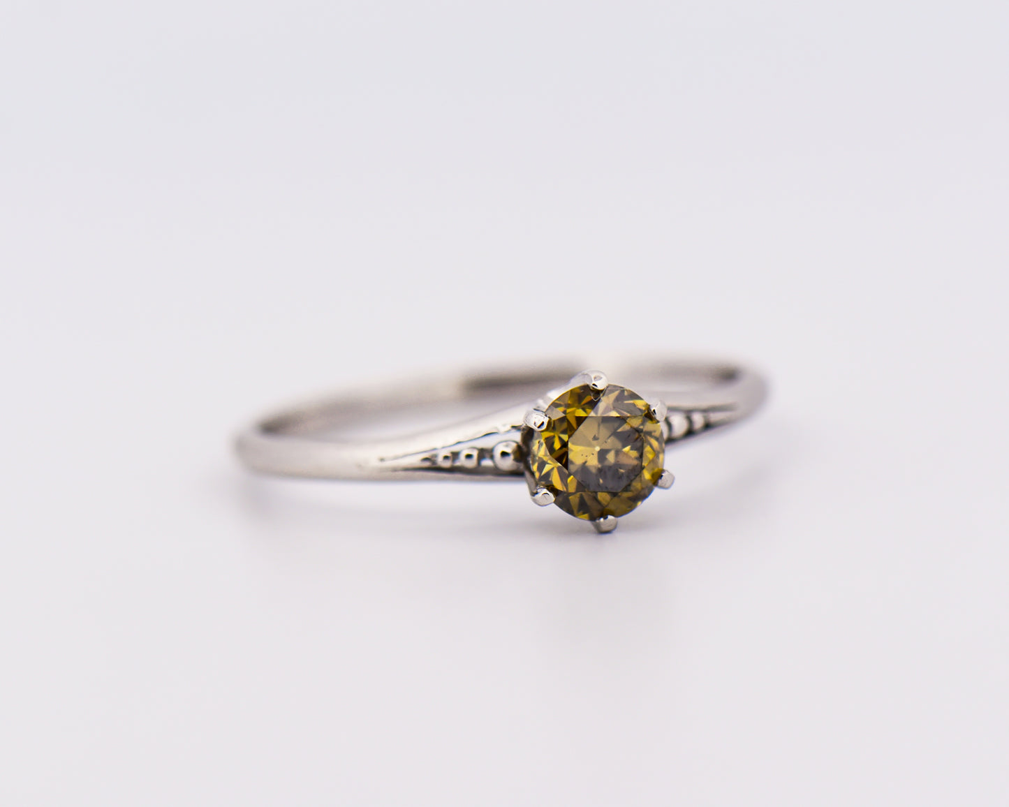 Antique Platinum Solitaire Ring with Olive Green Diamond