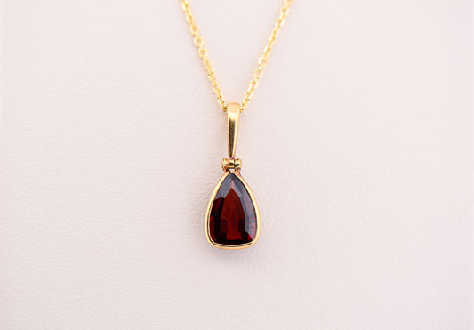 Bezel-Set Red Garnet Pendant in 18k Yellow Gold