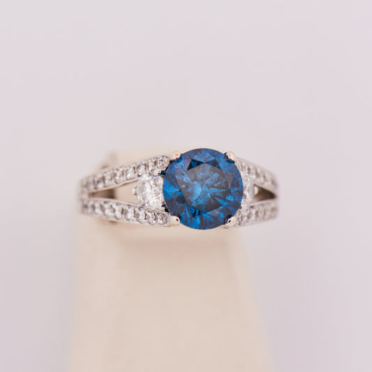 Round Blue Diamond Three-Stone Ring in White Gold