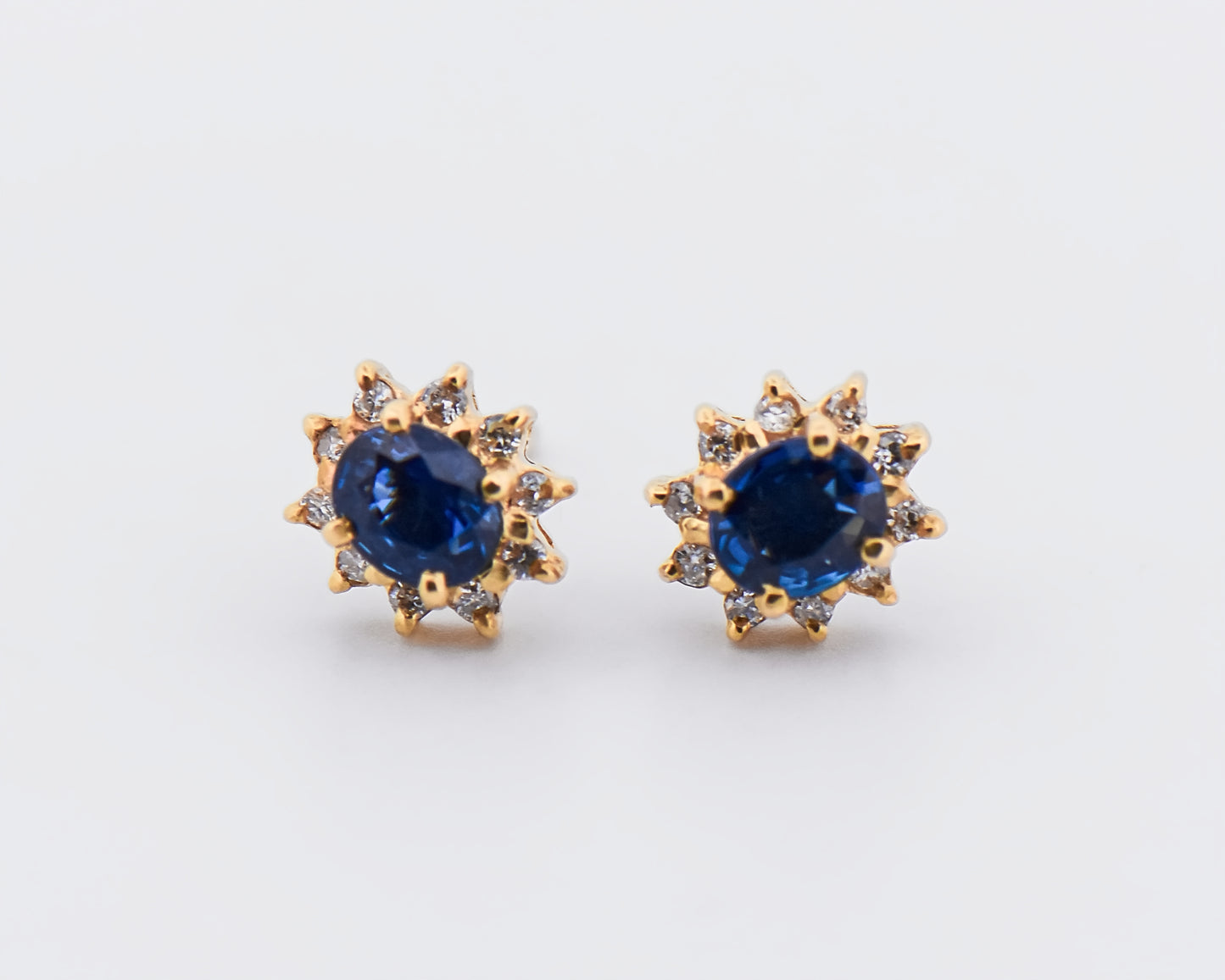 Blue Sapphire Halo Stud Earrings in Yellow Gold