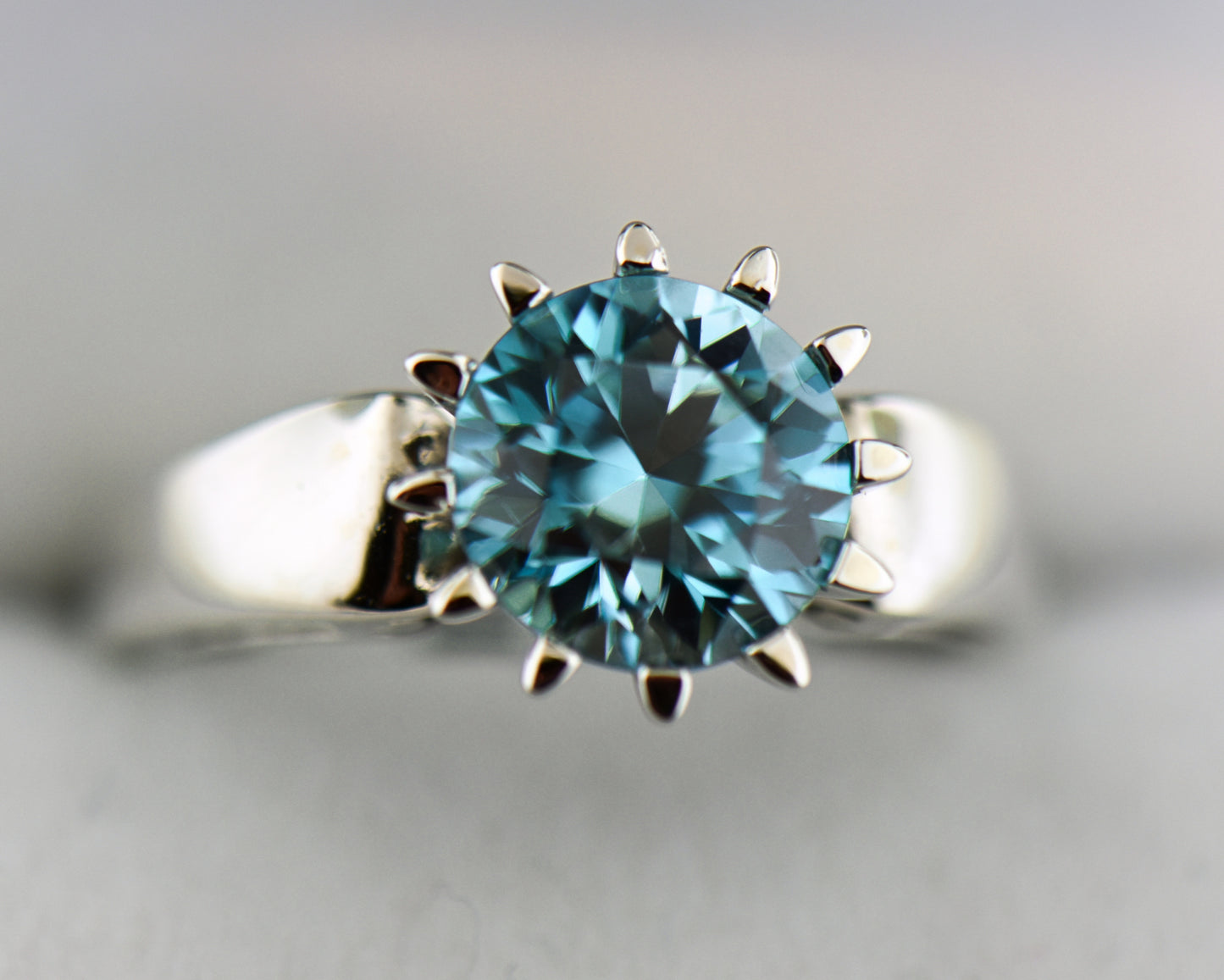 White Gold & Blue Zircon Crown-Style Solitaire Ring