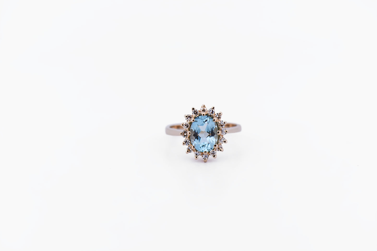 Classic Oval Aquamarine & Diamond Halo Ring in Yellow Gold