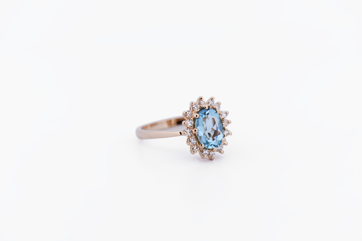 Classic Oval Aquamarine & Diamond Halo Ring in Yellow Gold