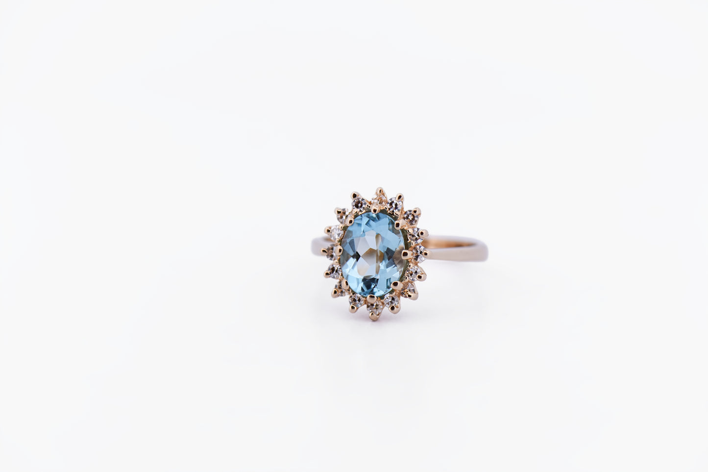 Classic Oval Aquamarine & Diamond Halo Ring in Yellow Gold