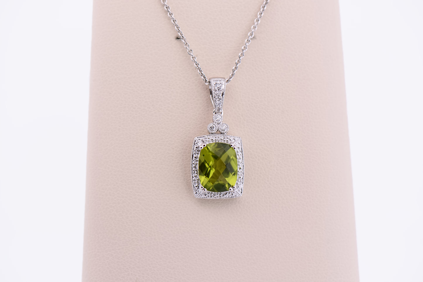 Cushion Cut Peridot Pendant with Diamond Halo in White Gold