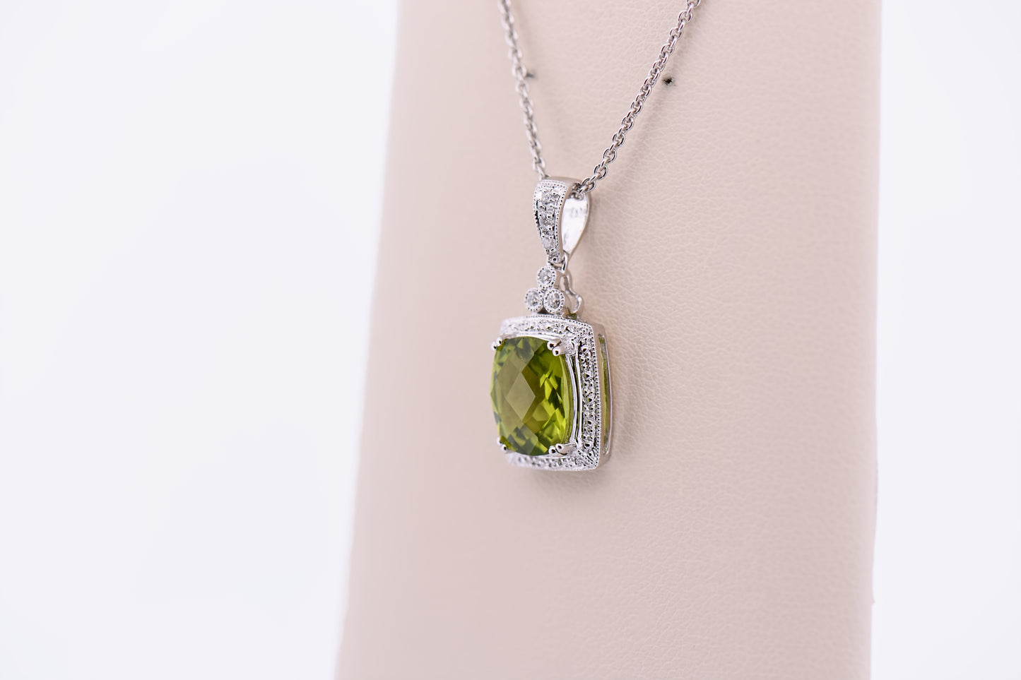 Cushion Cut Peridot Pendant with Diamond Halo in White Gold
