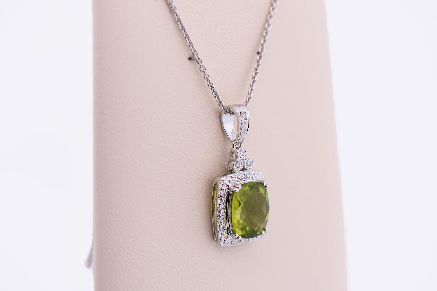 Cushion Cut Peridot Pendant with Diamond Halo in White Gold