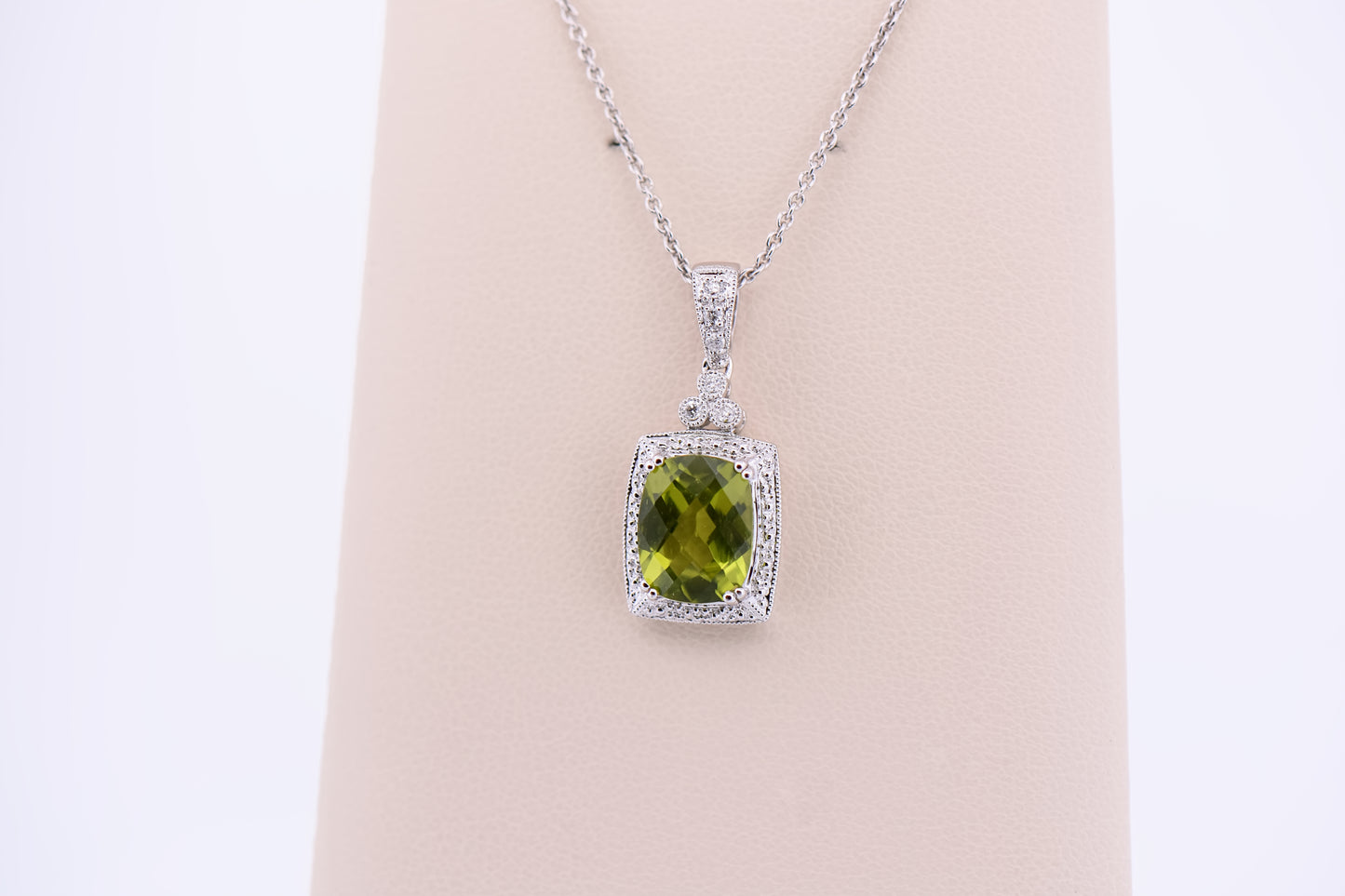 Cushion Cut Peridot Pendant with Diamond Halo in White Gold