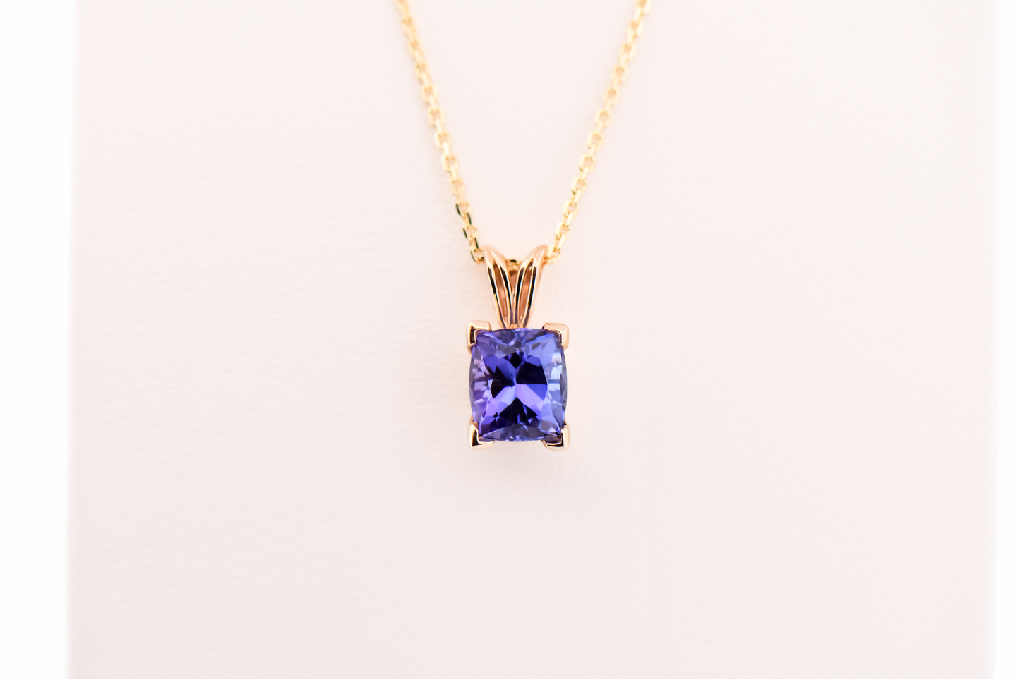 Cushion-Cut Tanzanite Solitaire Pendant in Yellow Gold