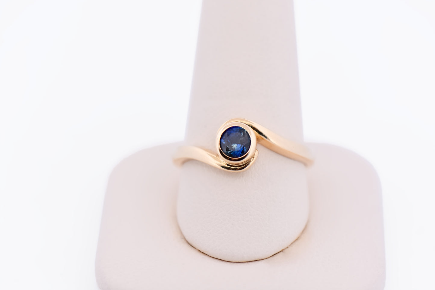 Custom Bezel Set Sapphire Swirl Engagement Ring in Yellow Gold