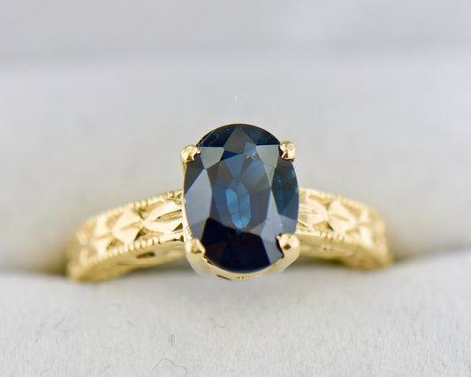 Navy Blue Sapphire Carved Yellow Gold Solitaire Ring