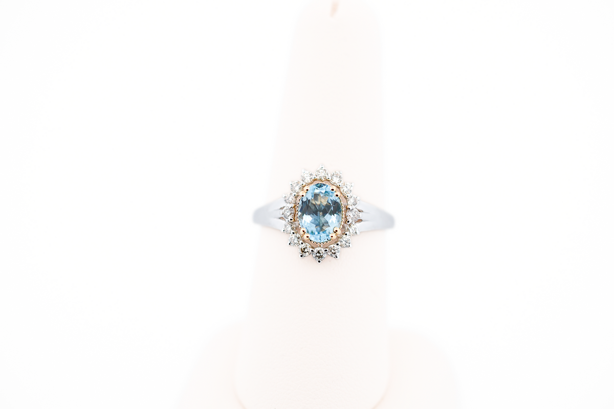 Deep Color Oval Aquamarine Ring with Diamond Halo in Two-Tone Gold
