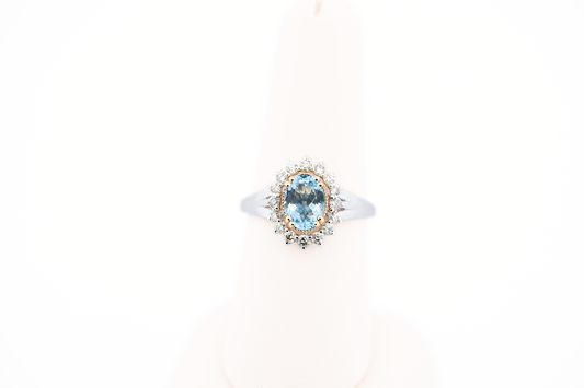 Deep Color Oval Aquamarine Ring with Diamond Halo in Two-Tone Gold