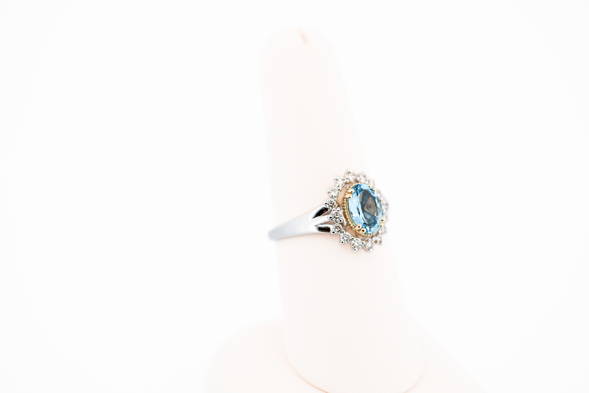 Deep Color Oval Aquamarine Ring with Diamond Halo in Two-Tone Gold